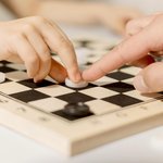 close-up-kid-playing-chess