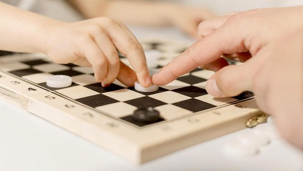 close-up-kid-playing-chess