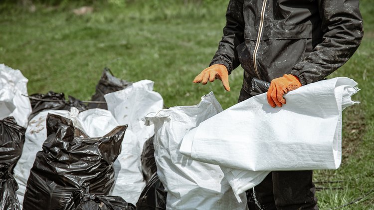 close-up-trash-bags-filled-with-trash-after-cleaning-environment