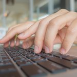 closeup-business-woman-hand-typing-laptop-keyboard