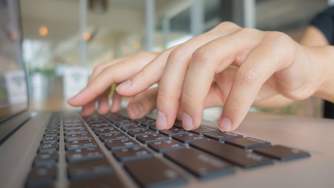 closeup-business-woman-hand-typing-laptop-keyboard
