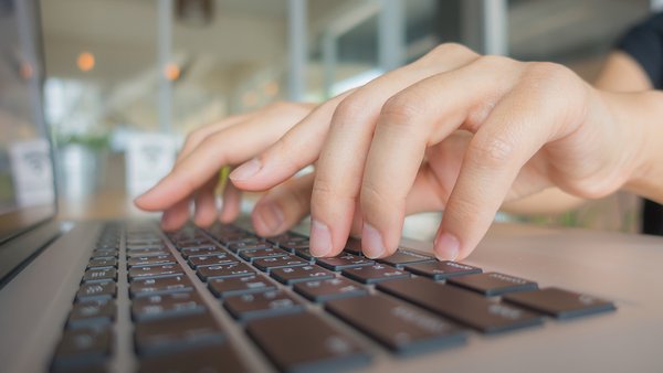 closeup-business-woman-hand-typing-laptop-keyboard