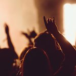dancing-concert-while-singer-is-performing-surrounded-with-lights