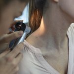 dermatologist-latex-gloves-holding-dermatoscope-while-examining-attractive-patient-with-skin-disease-female-dermatologist-examining-patient-with-dermascope-looking-signs-skin-cancer