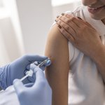 doctor-vaccinating-patient-clinic