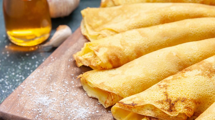 front-view-delicious-pancakes-rolled-dark-pie-meat-pastry-hotcake-dough-sweet-cake-meal-color