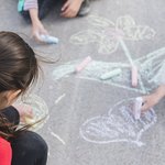 girl-drawing-with-chalk-road