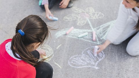 girl-drawing-with-chalk-road