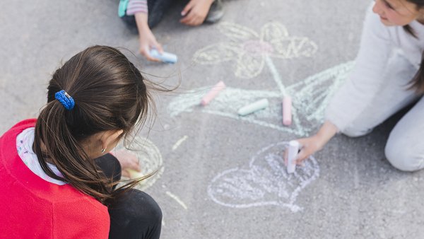 girl-drawing-with-chalk-road