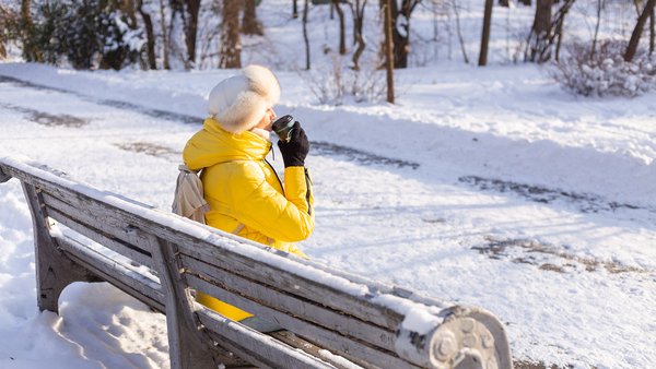 happy-young-woman-winter-warm-clothes-snowy-park-sunny-day-sits-benches-enjoys-fresh-air-coffee-alone