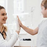 medium-shot-doctor-kid-high-fiving