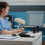 nurse-typing-computer-keyboard-consultation