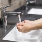person-washing-hands-with-soap