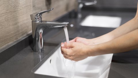 person-washing-hands-with-soap