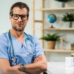 portrait-happy-confident-doctor-with-arms-crossed-medical-clinic