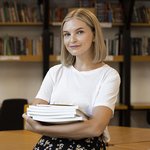 pretty-young-woman-posing-library