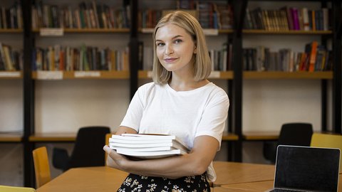 pretty-young-woman-posing-library