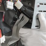 technician-hand-with-gloves-repairing-computer