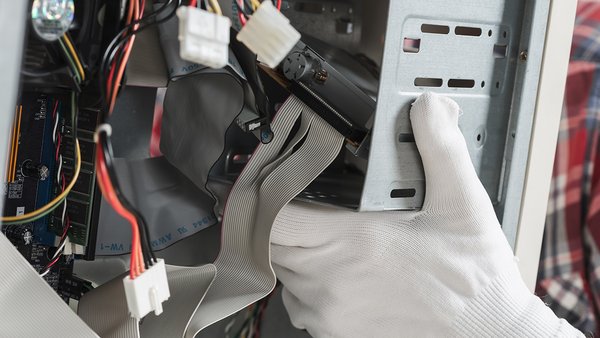 technician-hand-with-gloves-repairing-computer