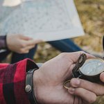 travelers-with-compass-map