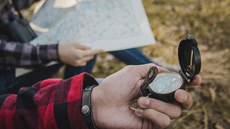 travelers-with-compass-map