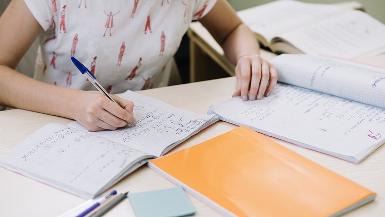 unrecognizable-girl-writing