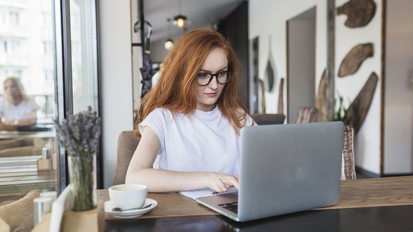 woman-working-laptop-cafe