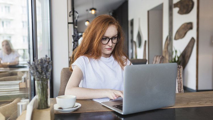 woman-working-laptop-cafe