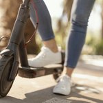 young-woman-rides-electrical-scooter-city