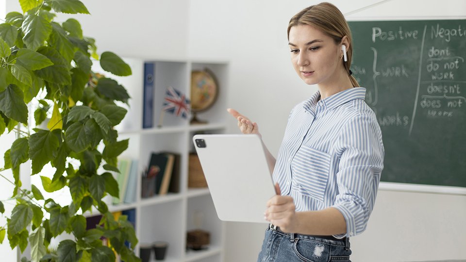 young-woman-teaching-students-english-class-online